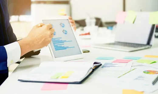 Reviewing practice charts and financial reports